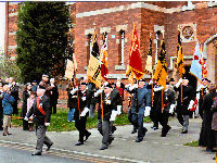 The standards are paraded out from the Keep and onto the road opposite the memorial